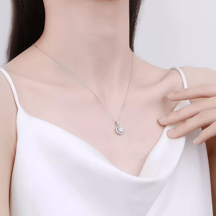 Sterling silver pendant necklace with 1 carat moissanite gemstone, showcasing a sleek and elegant jewelry design.