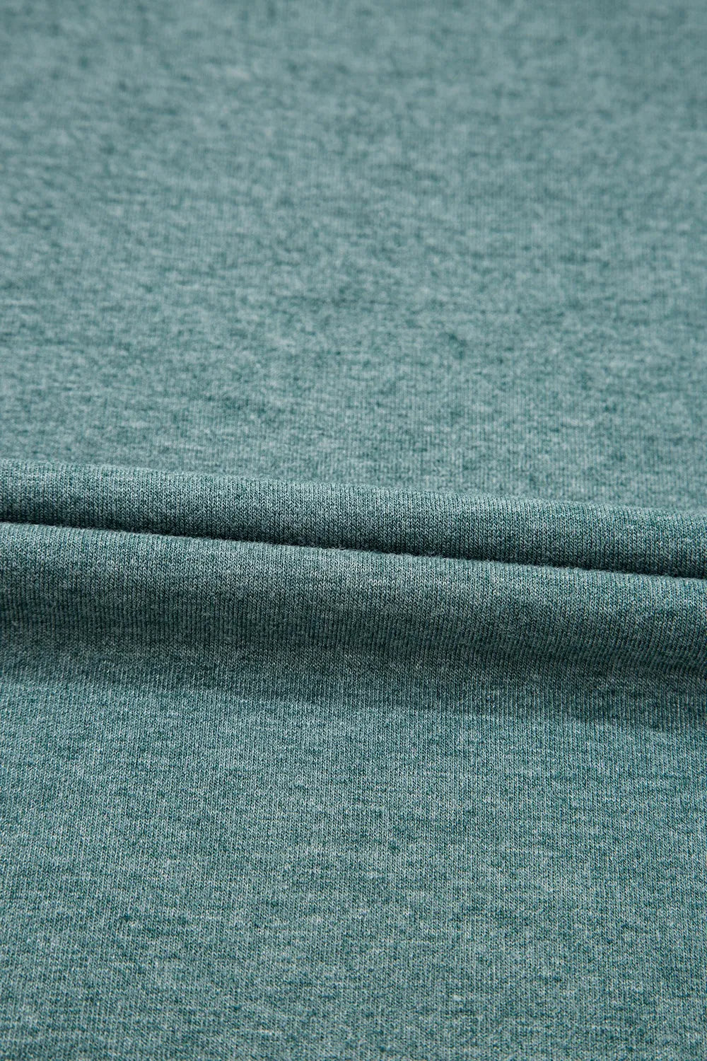 Classic V-Neck Tee from Trendsi, a stylish blouse with a V-neck design, displayed on a neutral background.