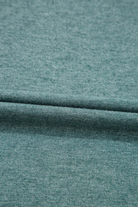 Classic V-Neck Tee from Trendsi, a stylish blouse with a V-neck design, displayed on a neutral background.