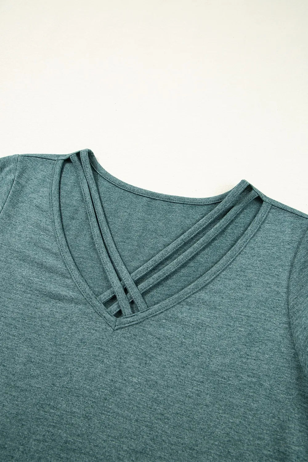 Classic V-Neck Tee from Trendsi featuring a soft, comfortable blouse style with a V-neck design, shown in a neutral color.