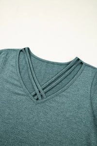 Classic V-Neck Tee from Trendsi featuring a soft, comfortable blouse style with a V-neck design, shown in a neutral color.