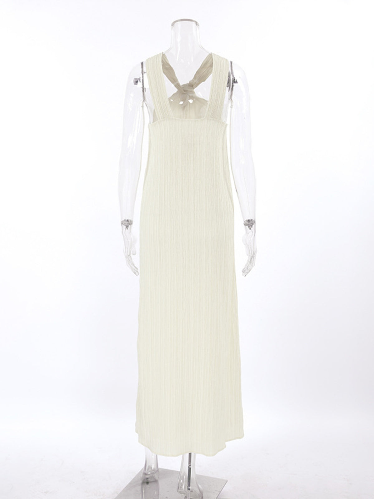 Elegant black halter neck maxi dress by Trendsi featuring a flowing silhouette and sleeveless design.