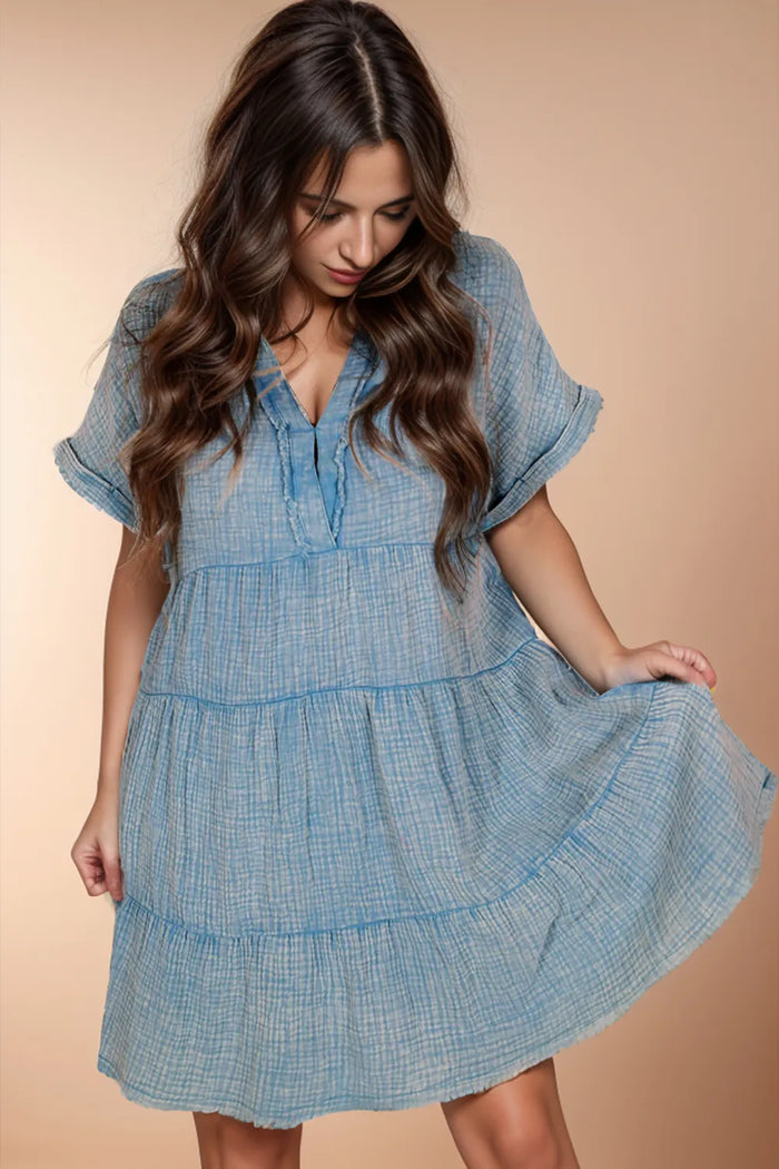 Tiered notched neck cotton dress by Trendsi, featuring a flowing design and soft fabric, perfect for casual wear.