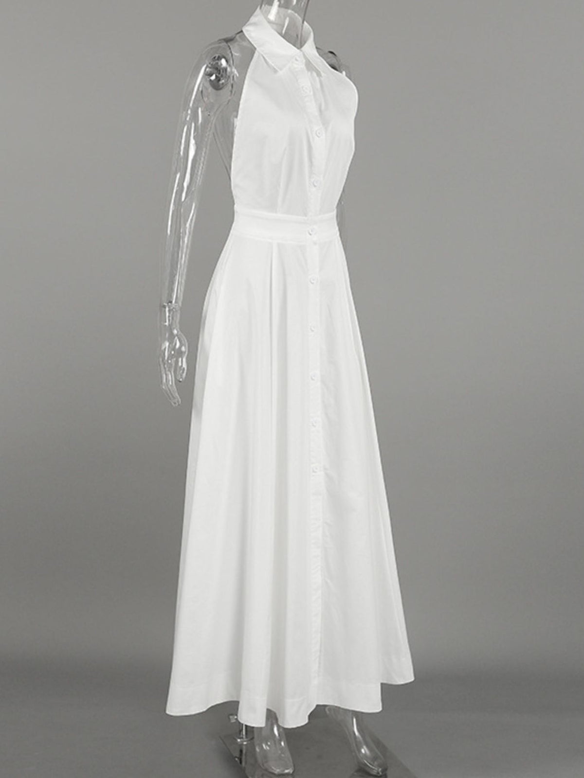 Backless button-front maxi dress from Trendsi featuring a flowing silhouette and elegant design, displayed on a model.