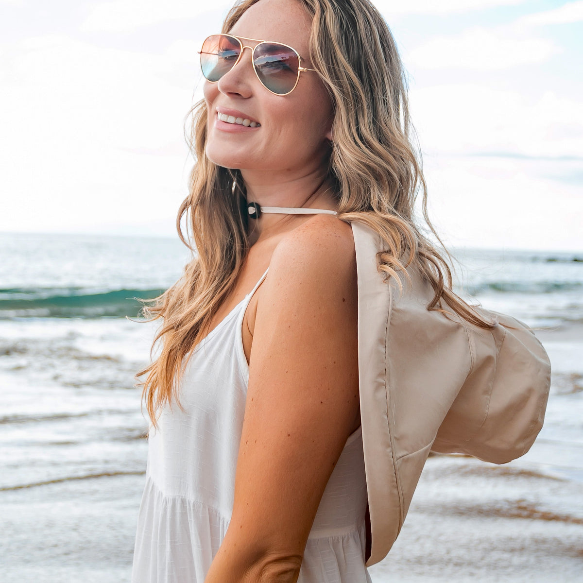 A person wearing a navy drawstring cargo hat from Aili's Corner, showcasing the adjustable brim and cargo-style design.