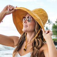 Aili's Corner drawstring cargo hat with adjustable straps and multiple pockets, stylish accessory for outdoor wear.