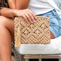 Aili's Corner macrame tassel clutch handbag with intricate woven design and hanging tassels, featuring a compact, stylish accessory.