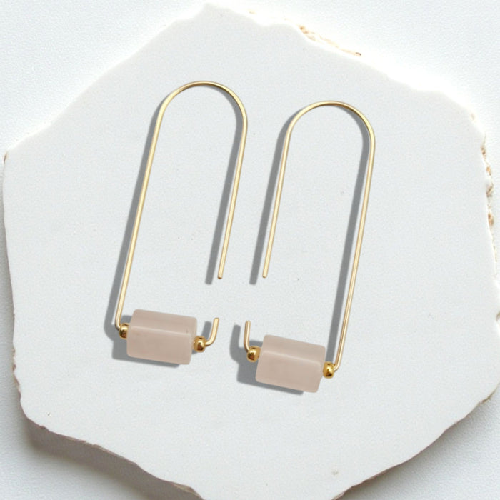 Gold and rose quartz earrings from Bijou by SAM featuring elegant dangle design with gemstone accents.