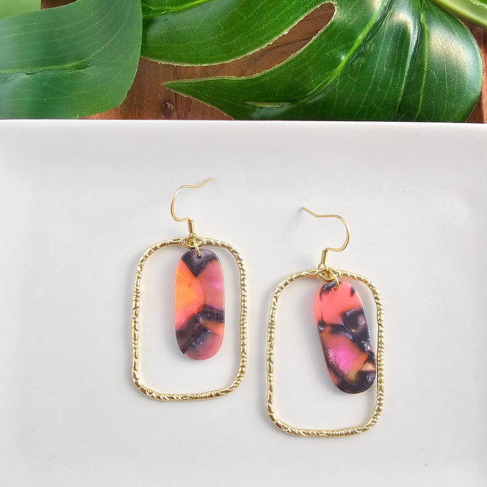 Spiffy & Splendid Madison Earrings featuring Bird of Paradise design with colorful floral accents and gold-tone hooks.