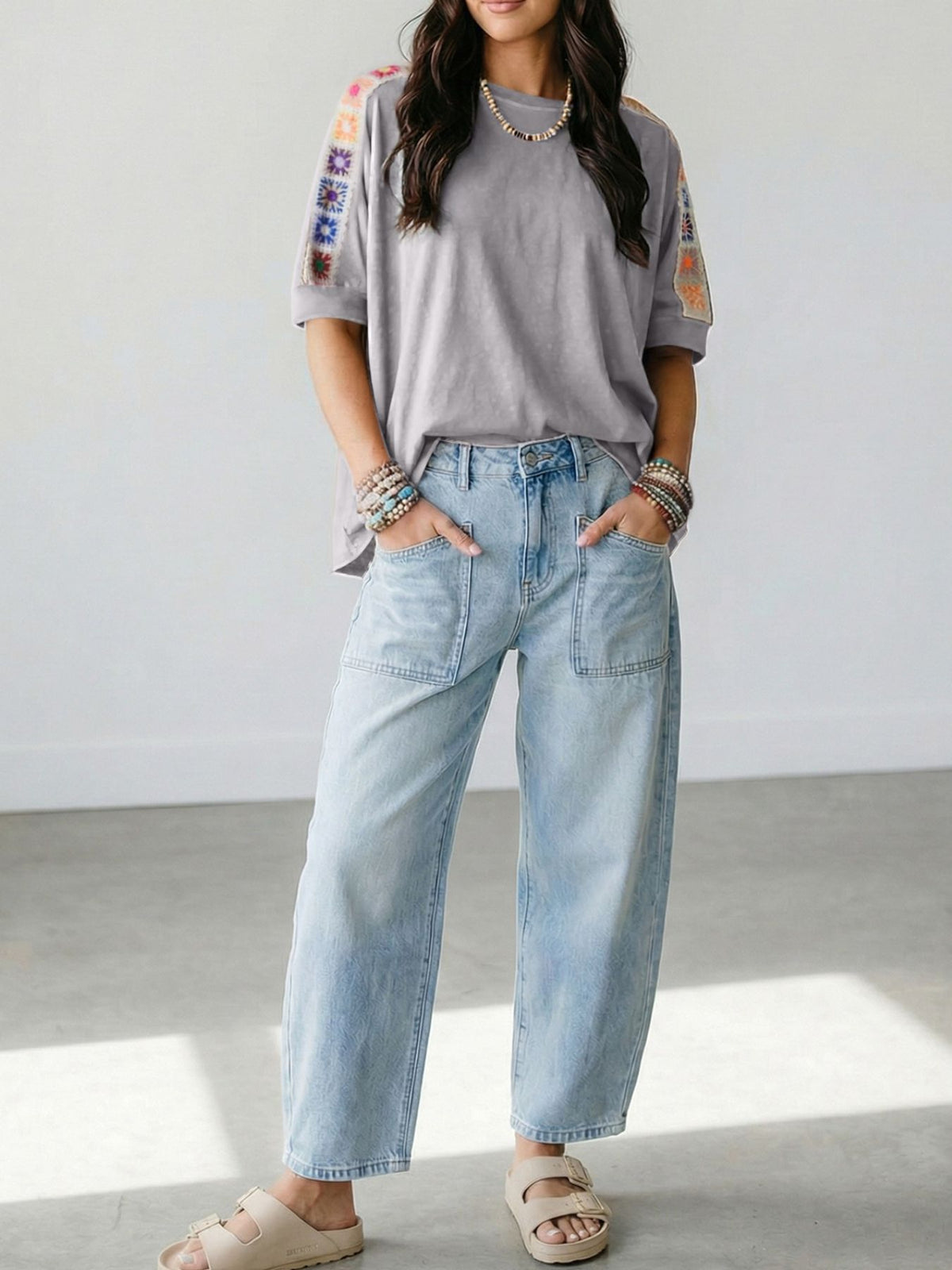 Square crochet detail loose T-shirt from Trendsi, featuring a relaxed fit and stylish crochet accents on the blouse.