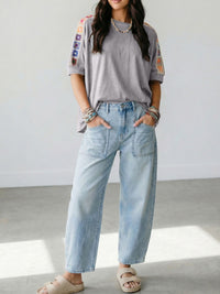 Square crochet detail loose T-shirt from Trendsi, featuring a relaxed fit and stylish crochet accents on the blouse.