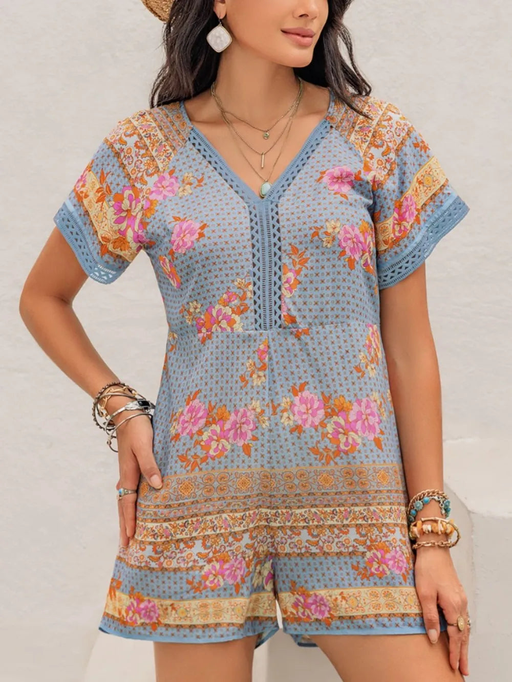 Printed cutout romper from Trendsi, stylish jumpsuit with bold pattern, featuring cutout details and a flattering fit.
