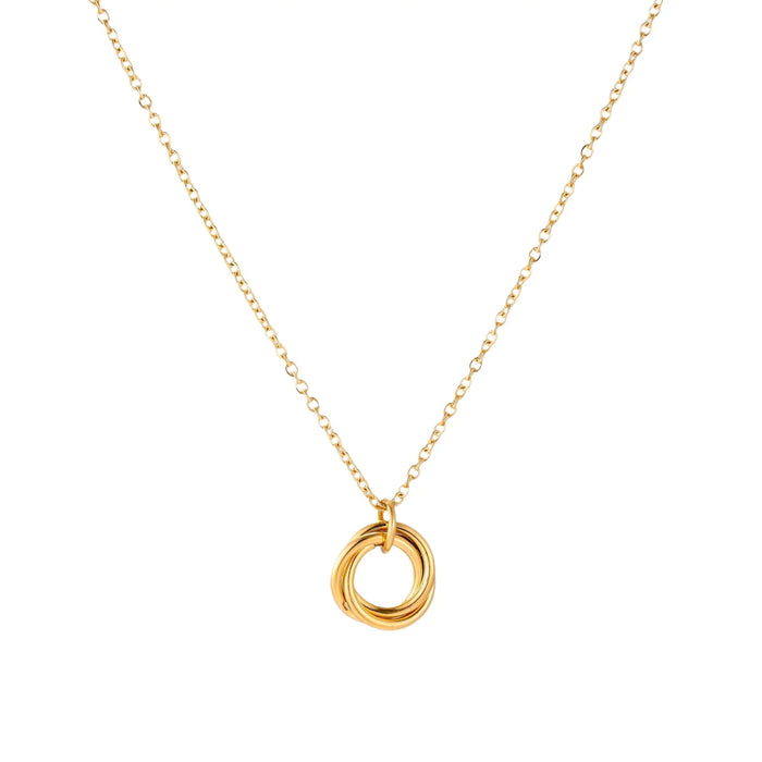 Delicate gold-plated necklace with three interlocking circle rings forming a minimalist knot pendant on cream background