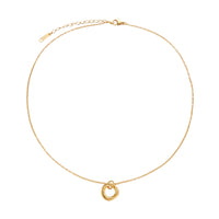 Delicate gold-plated necklace with three interlocking circle rings forming a minimalist knot pendant on cream background