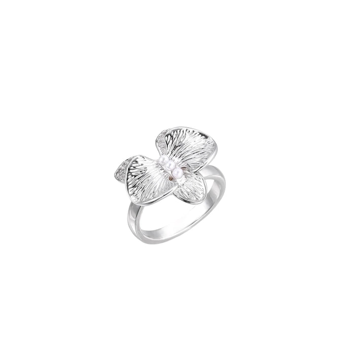 Silver-toned orchid ring with textured petals, pearl center accents, and sparkling zirconia stones on white background.