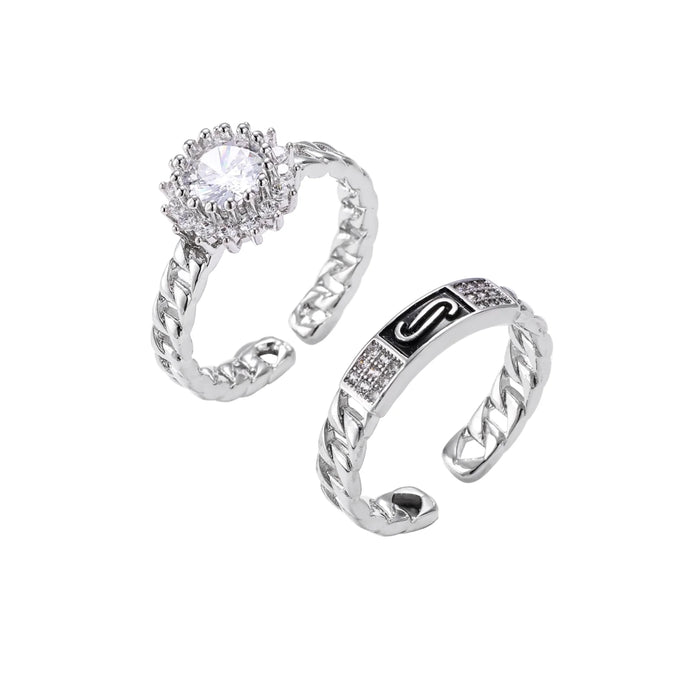 Two adjustable white gold plated rings with chain-link bands, featuring cubic zirconia halo and enamel details
