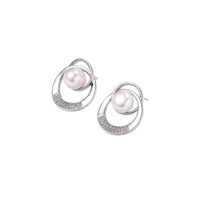 White gold-plated brass earrings with circular design, freshwater pearl center, and diamond accents