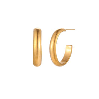 Chunky brushed gold hoop earrings in 14K plated stainless steel on cream background, front and side view.