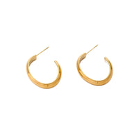 Chunky brushed gold hoop earrings in 14K plated stainless steel on cream background, front and side view.