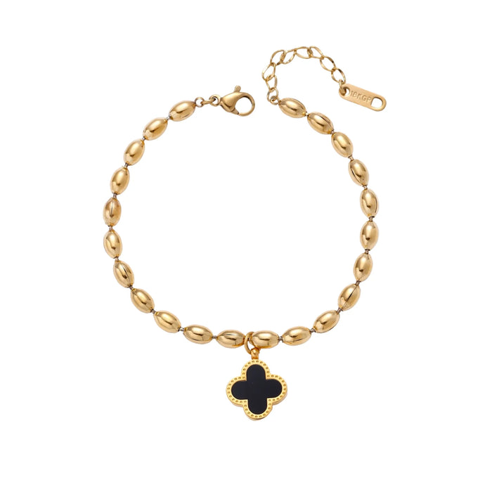 18K gold-plated oval bead chain bracelet with quatrefoil clover charm featuring mother of pearl inlay on cream background