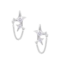 Silver star studs with crescent moon cutouts and zirconia stones connected by delicate chains on white background