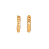 Gold-toned hoop earrings with hammered dimpled texture and post closure on cream background