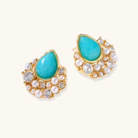 Gold-plated cluster earrings with teardrop turquoise stones surrounded by white pearls and clear crystals