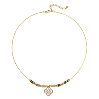 Gold-toned beaded necklace with grey stones and quatrefoil abalone shell pendant on cream background.