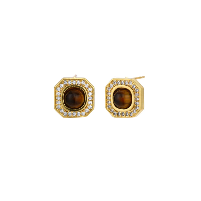 Gold-plated octagonal stud earrings with brown tiger's eye centers and cubic zirconia border on cream background.