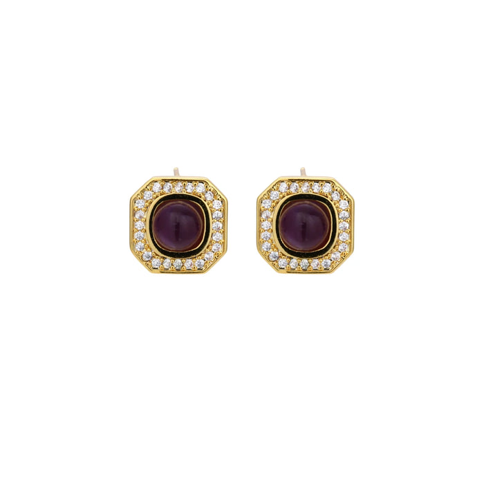 Gold-plated octagonal stud earrings with burgundy liuli centers and cubic zirconia halos on white background
