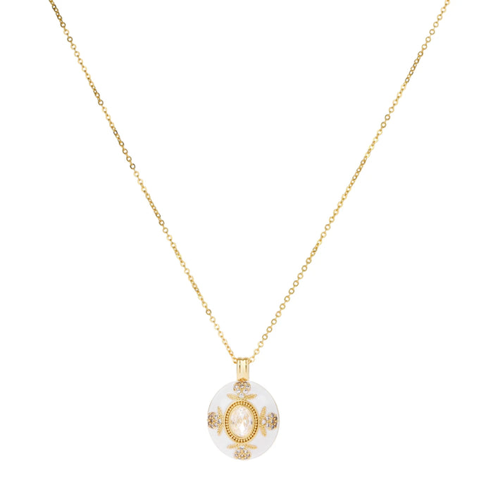 Gold-plated necklace with circular white enamel pendant featuring central zirconia stone and ornate decorative details