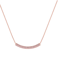 Rose gold jewelry set with pavé cubic zirconia stones including curved necklace, hoop earrings, and adjustable ring on cream background.