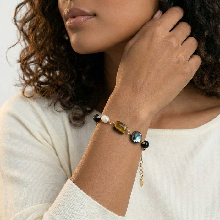 Earth Elements bracelet from The Glambox Jewels Boutique featuring natural stone beads and earthy tones on a stretchy cord.