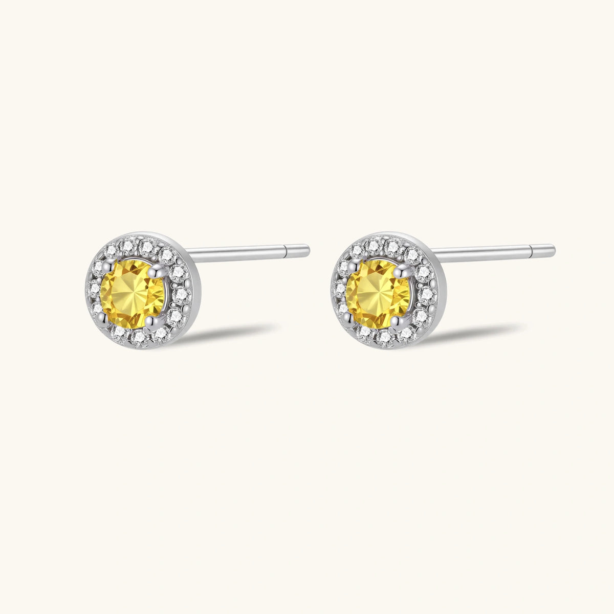 Sunburst Halo Stud Earrings by The Glambox Jewels Boutique, gold-tone earrings with radiant sunburst and halo design.