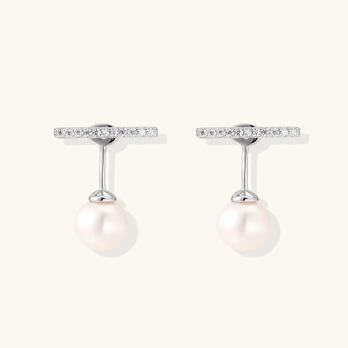 Pearl drop T-bar earrings featuring elegant white pearls and sleek silver T-bar design, perfect for sophisticated style.