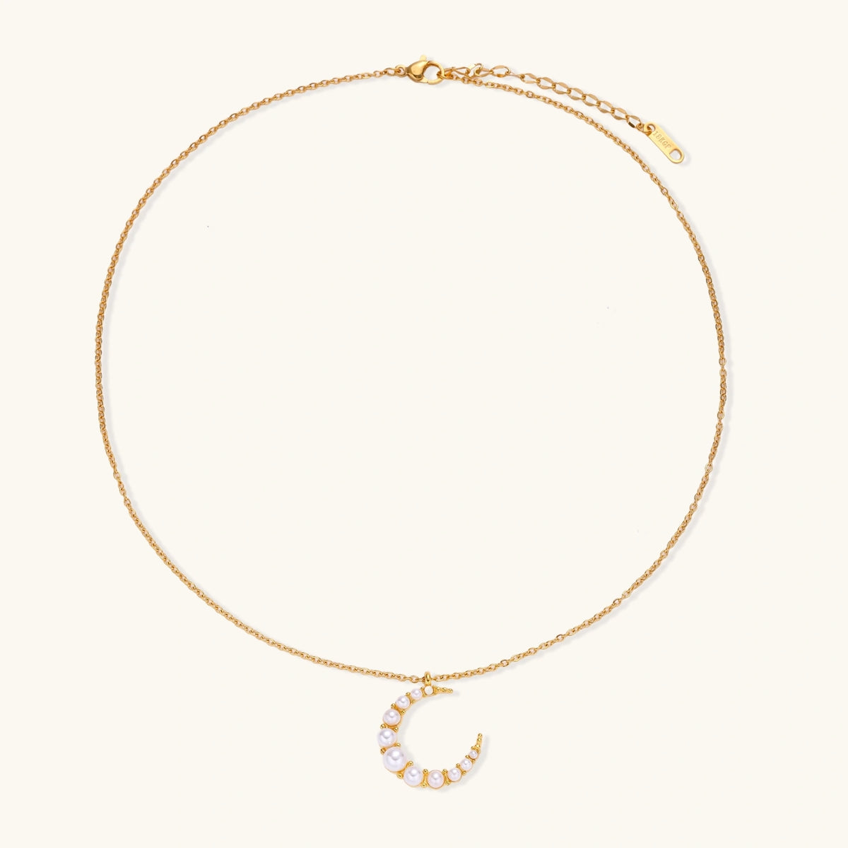 Luna Pearl Crescent Necklace by The Glambox Jewels Boutique featuring a delicate crescent pendant with a luminous pearl.