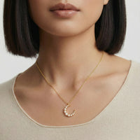 Luna Pearl Crescent Necklace featuring a delicate crescent-shaped pendant with a lustrous pearl, from The Glambox Jewels Boutique.