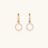 Halo circle hoop earrings from The Glambox Jewels Boutique featuring shiny metal hoops with a halo design.