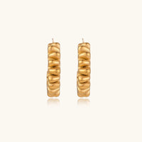 Gold twisted hoop earrings from The Glambox Jewels Boutique, featuring a stylish and elegant design.