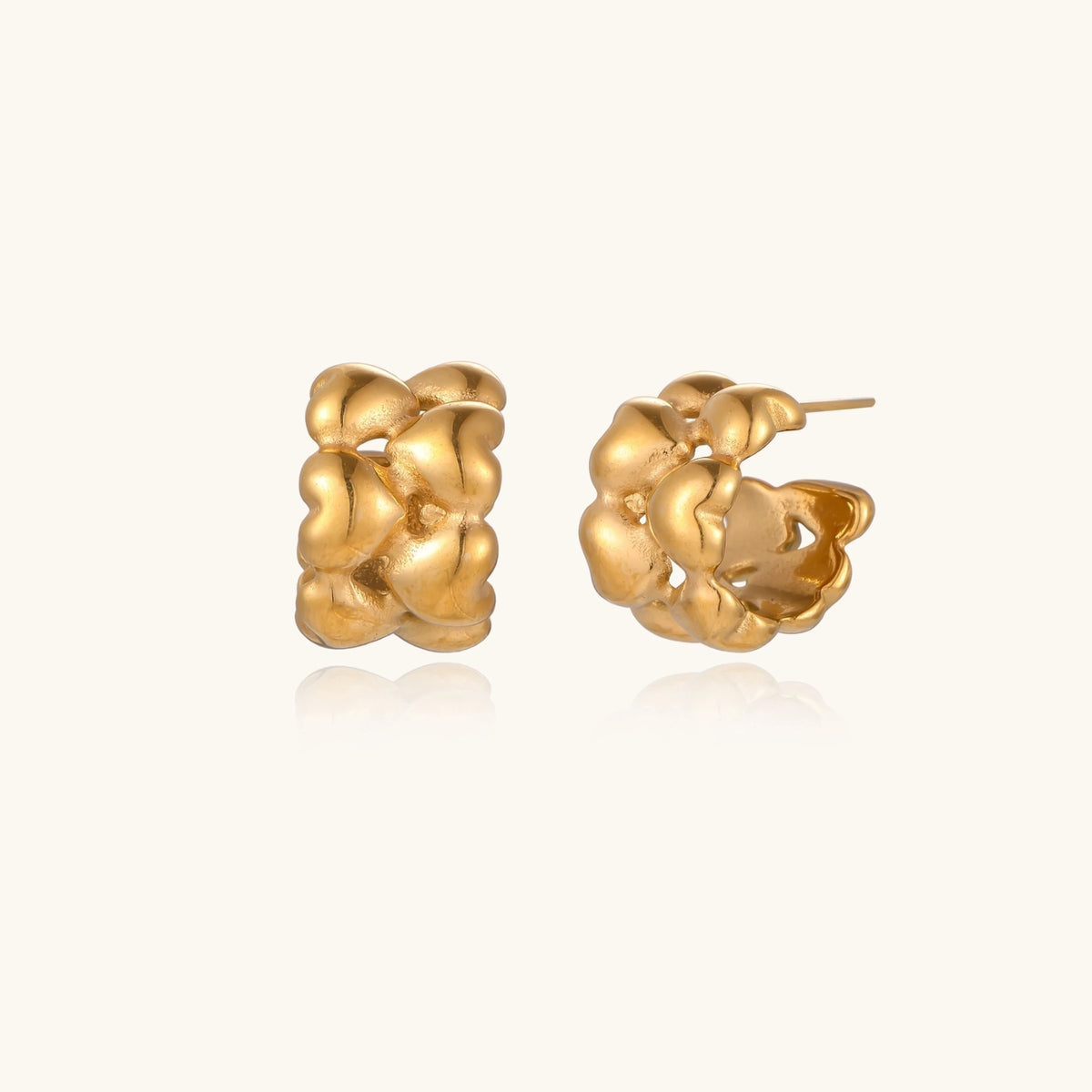 Silver braided hoops earrings from The Glambox Jewels Boutique with intricate woven design.