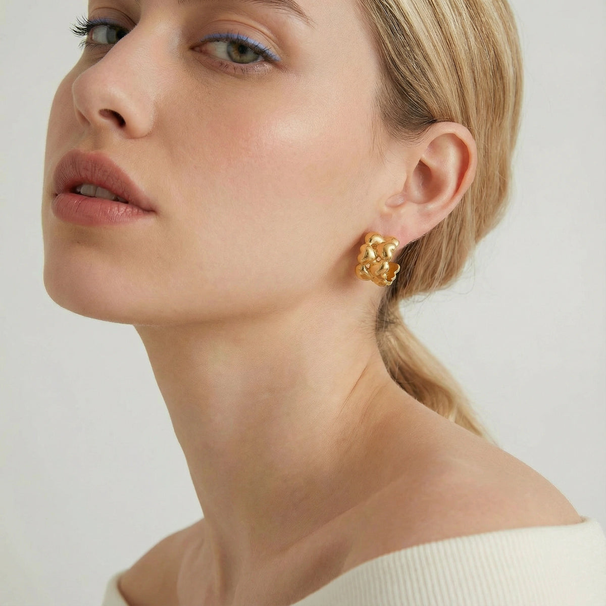 Silver braided hoops earrings from The Glambox Jewels Boutique featuring intricate woven design and classic hoop style.