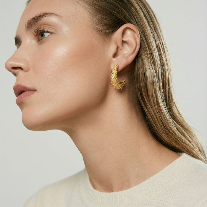 Textured crescent hoop earrings from The Glambox Jewels Boutique, showcasing stylish silver hoop jewelry with a textured finish.
