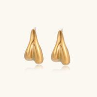 Sculpted drop earrings by The Glambox Jewels Boutique featuring sleek, modern design with a polished finish.