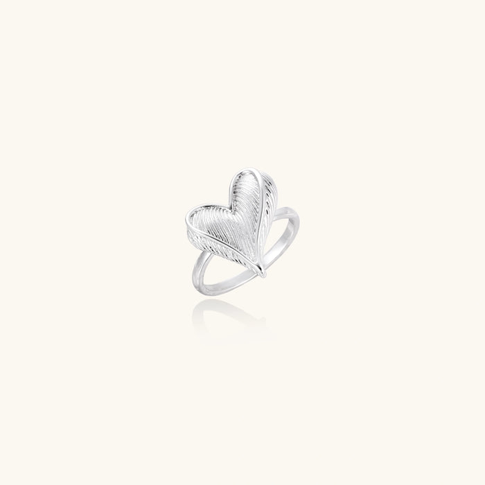Feathered Heart Ring from The Glambox Jewels Boutique featuring a delicate heart-shaped design with feather detailing.