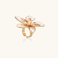 Gold Lily Bloom ring from The Glambox Jewels Boutique featuring a delicate floral design and adjustable band.