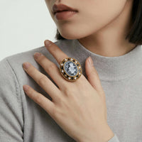 Victorian Rose Cameo ring with intricate carved profile on a gold-tone band, elegant vintage jewelry piece.