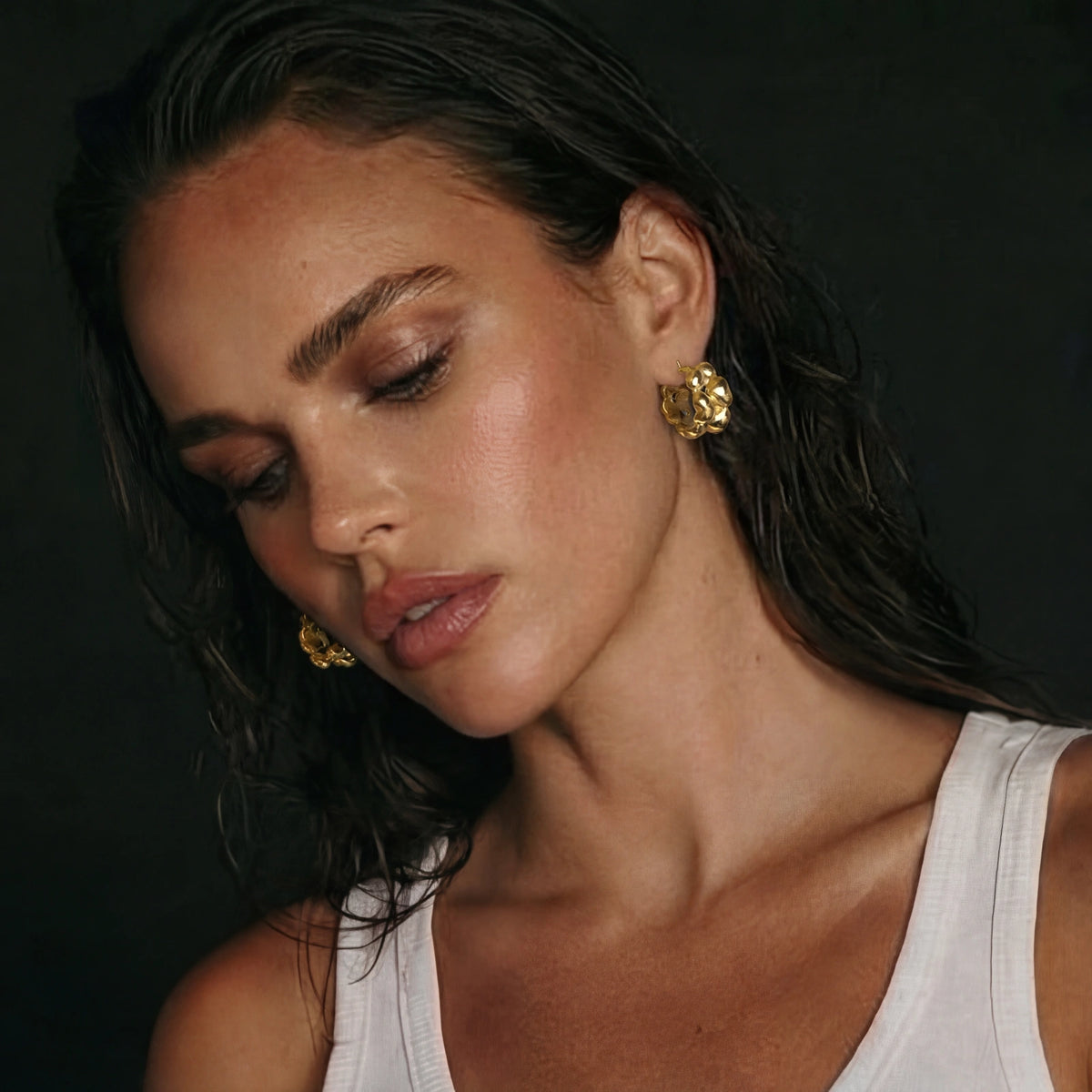 Gold braided hoop earrings from The Glambox Jewels Boutique featuring intricate braided design and polished finish.