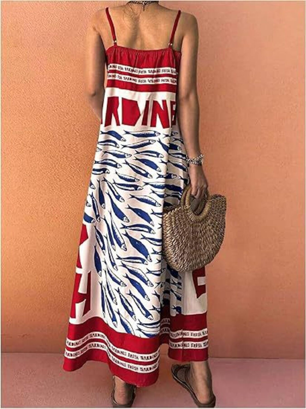 Sardine print spaghetti strap maxi dress from Trendsi featuring a flowy silhouette and vibrant fish pattern.