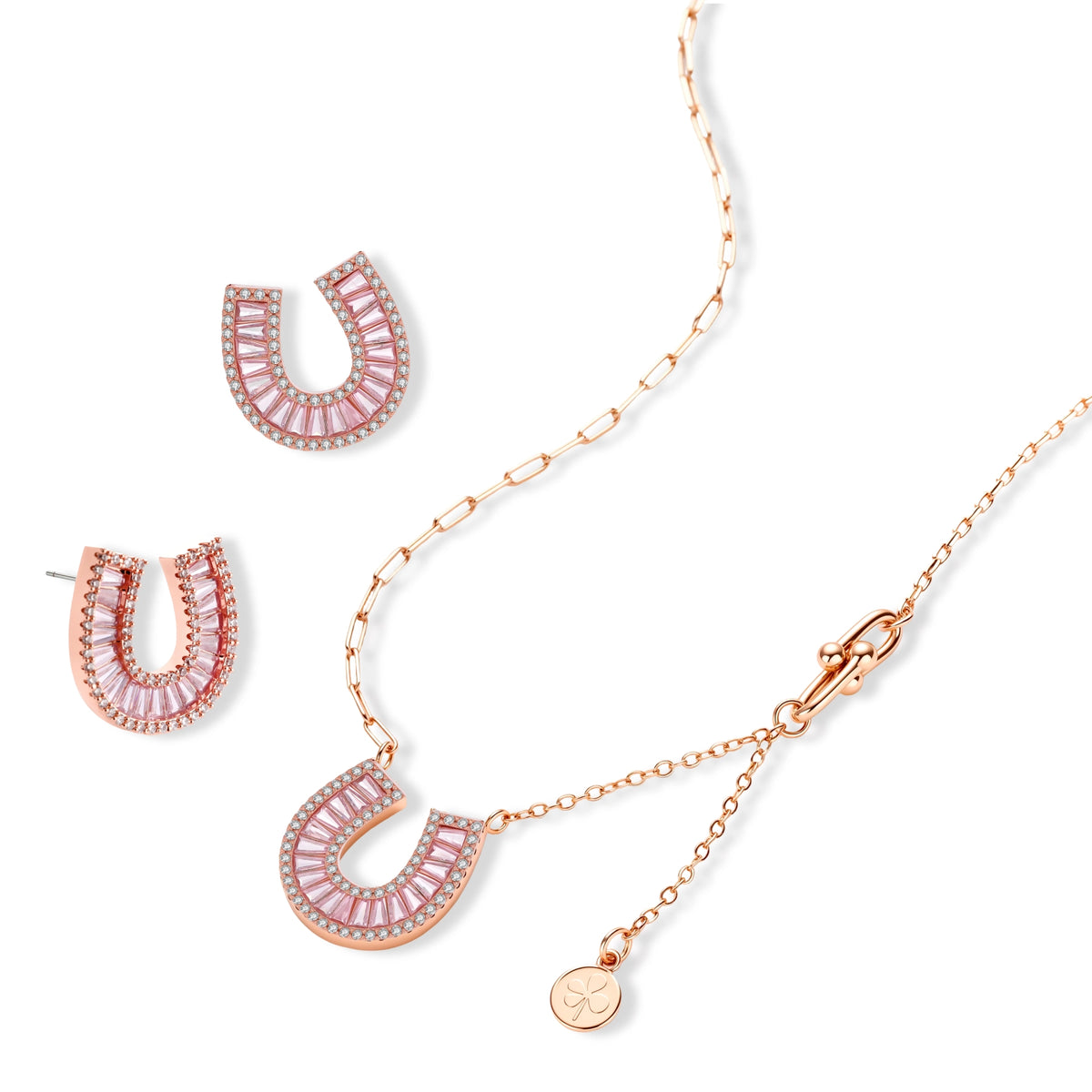Sparkling horseshoe-shaped jewelry set with AAA cubic zirconia in gold-plated and white gold finishes on cream background.