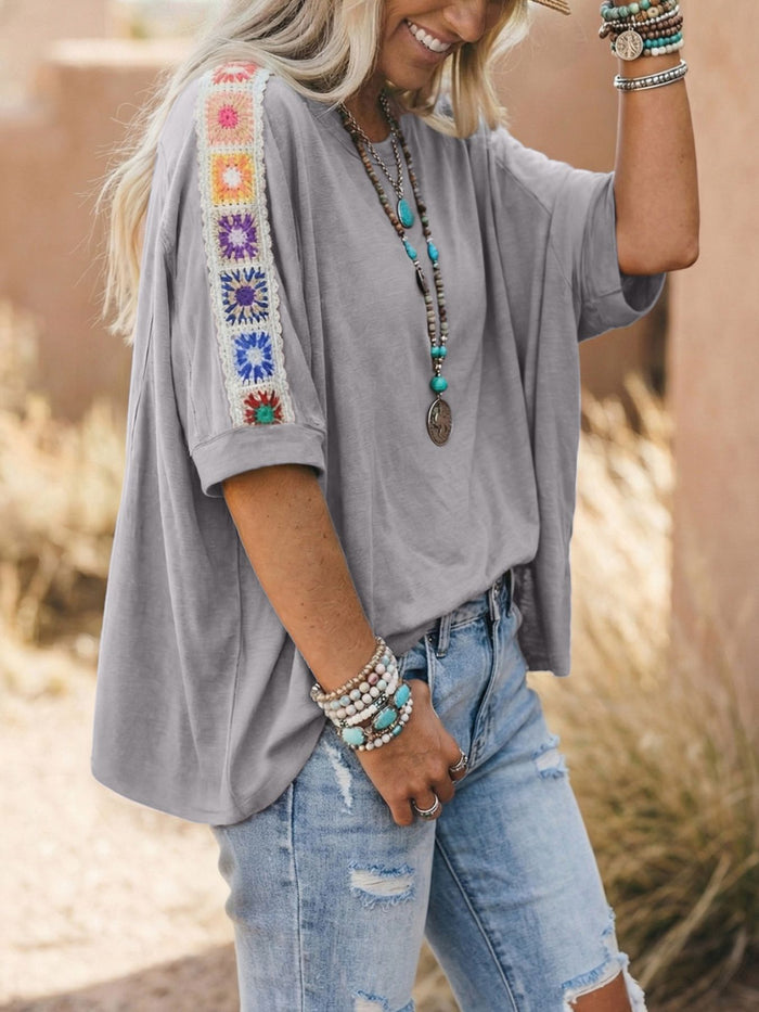 Square crochet detail loose T-shirt from Trendsi, casual blouse with crochet accents and relaxed fit, shown on a model.